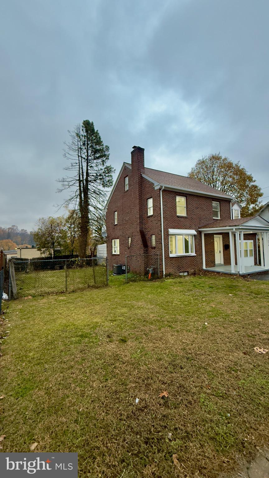 2319 Fairview Avenue Reading, PA 19606 - Photo 57 of 58 a front view of a house with a garden and lake view