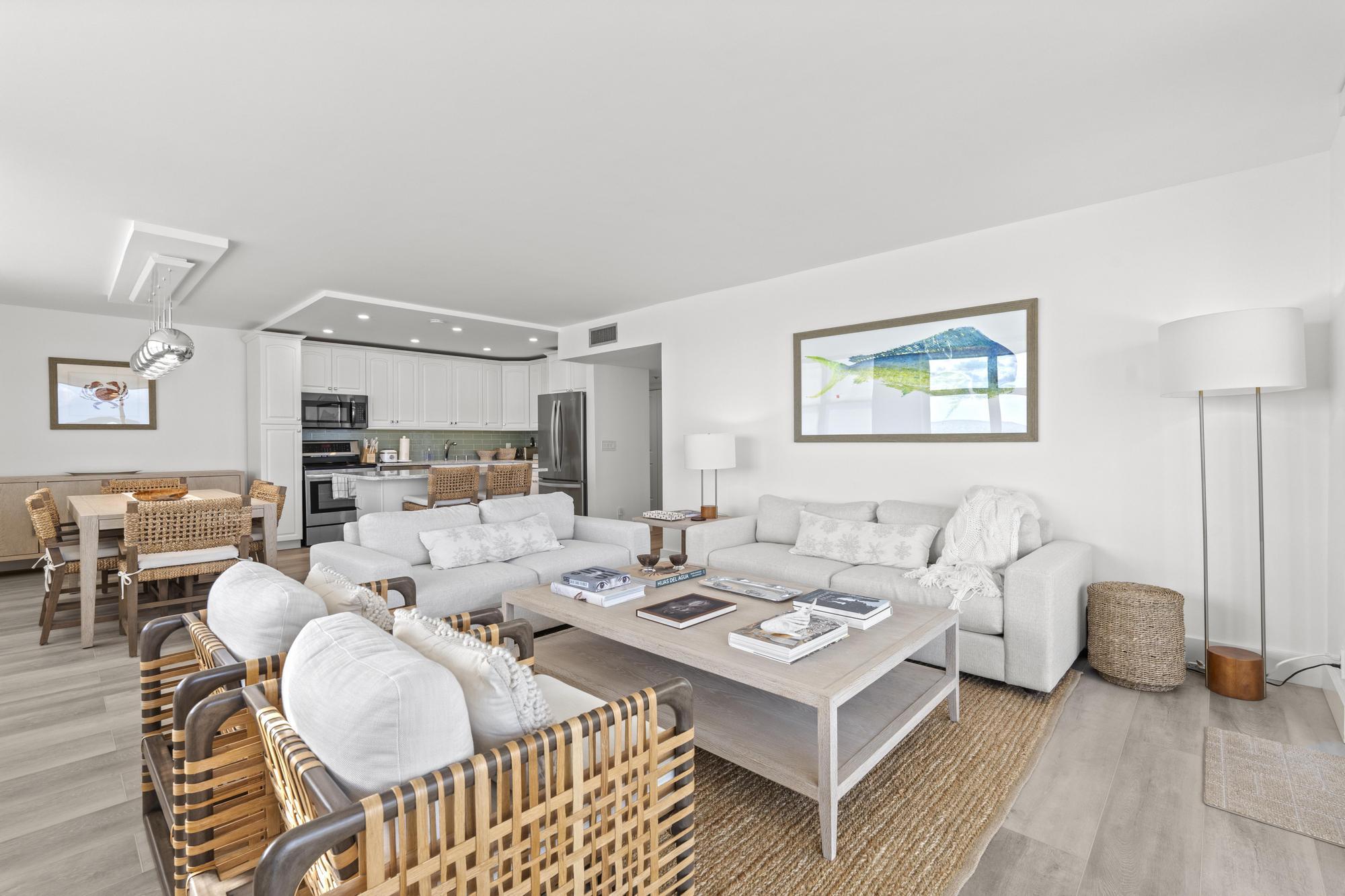 5440 North Ocean Drive, Unit 306 Singer Island, FL 33404 - Photo 13 of 43 a living room with furniture and a table