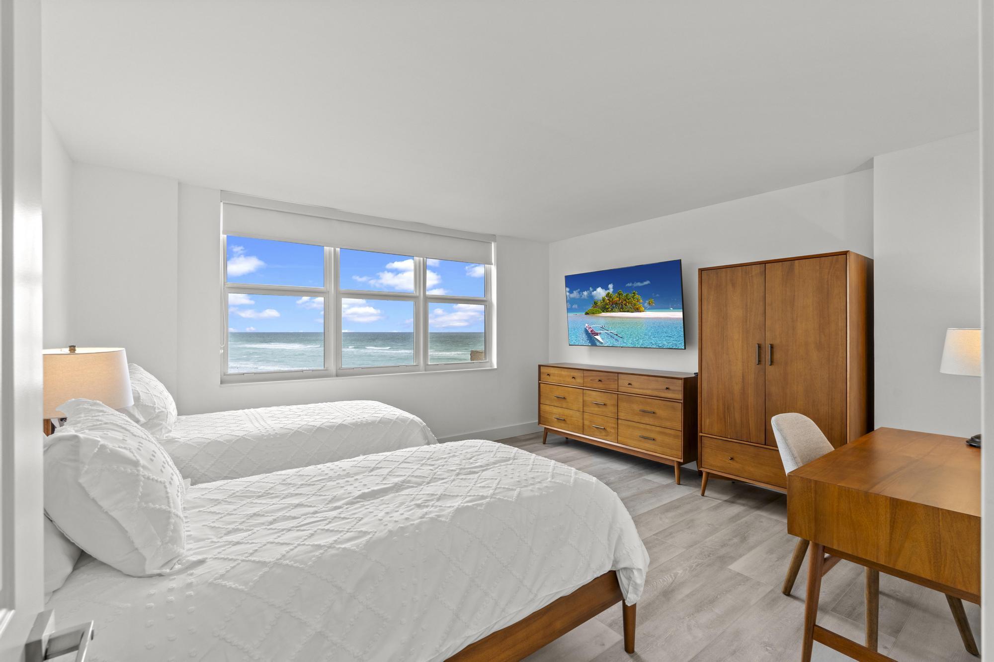 5440 North Ocean Drive, Unit 306 Singer Island, FL 33404 - Photo 30 of 43 a bedroom with a bed and a window