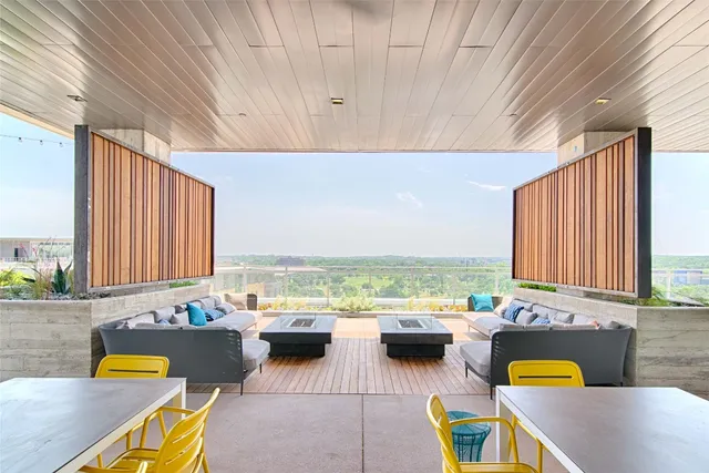 a view of a swimming pool and outdoor seating