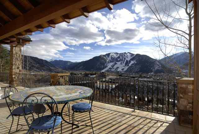 a view of a balcony with furniture