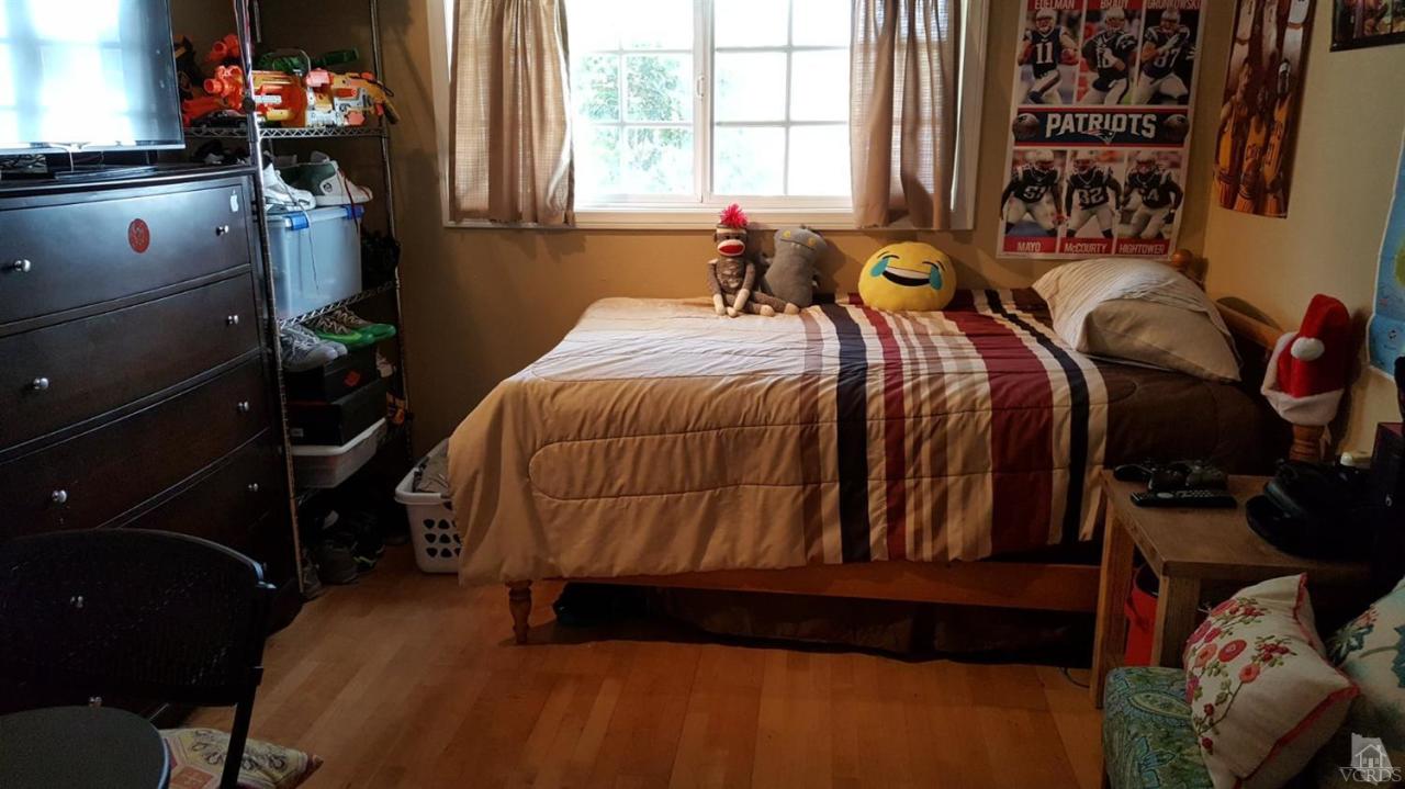 6392 White Street Simi Valley, CA 93063 - Photo 16 of 30 a bed sitting in a bedroom next to a window