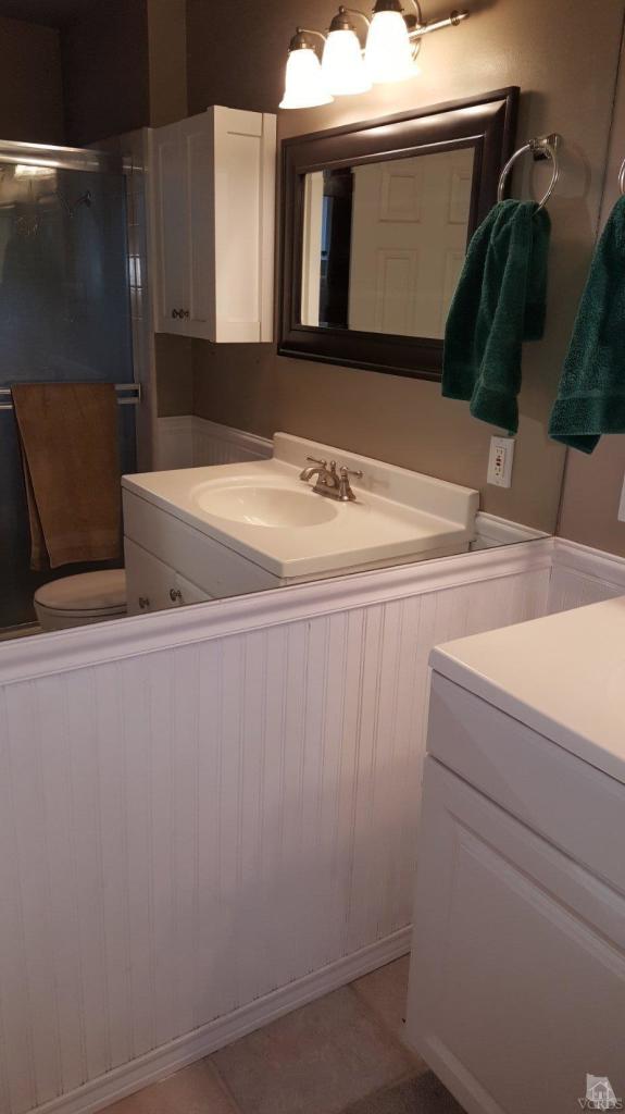 6392 White Street Simi Valley, CA 93063 - Photo 19 of 30 a bathroom with a sink and a mirror