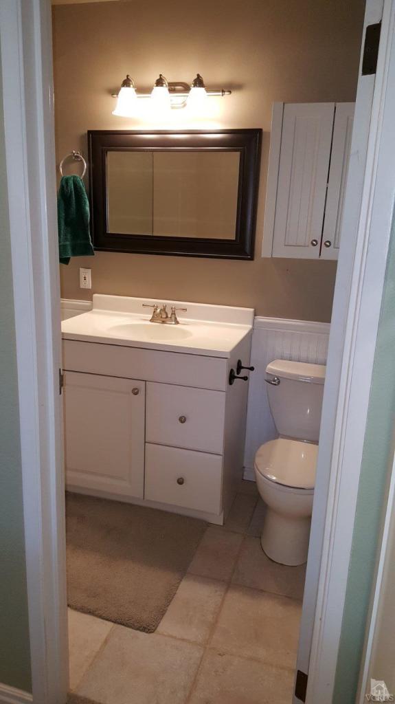 6392 White Street Simi Valley, CA 93063 - Photo 20 of 30 a bathroom with a sink toilet and mirror