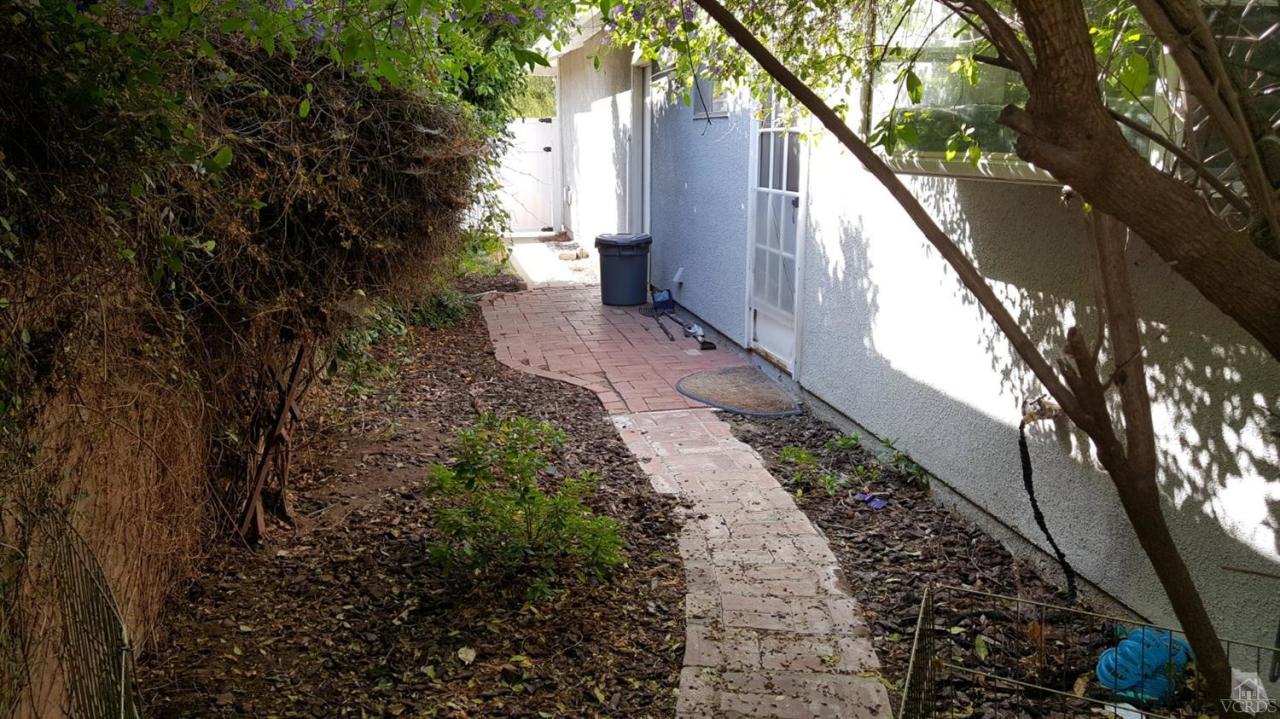 6392 White Street Simi Valley, CA 93063 - Photo 22 of 30 a view of a house with a yard