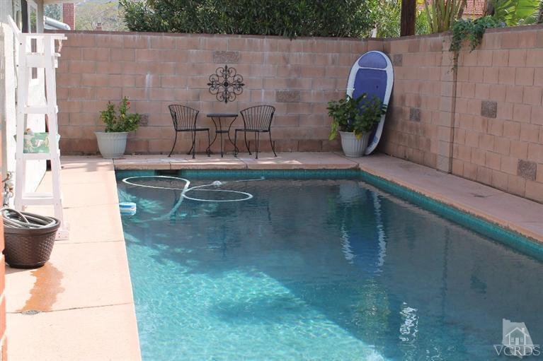 6392 White Street Simi Valley, CA 93063 - Photo 23 of 30 a view of a swimming pool with a potted plant