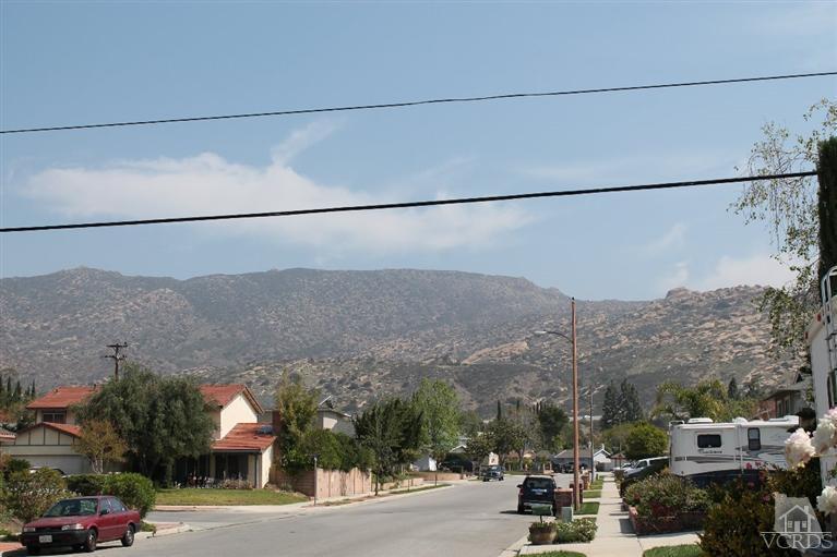 6392 White Street Simi Valley, CA 93063 - Photo 27 of 30 a view of a city street with parked cars