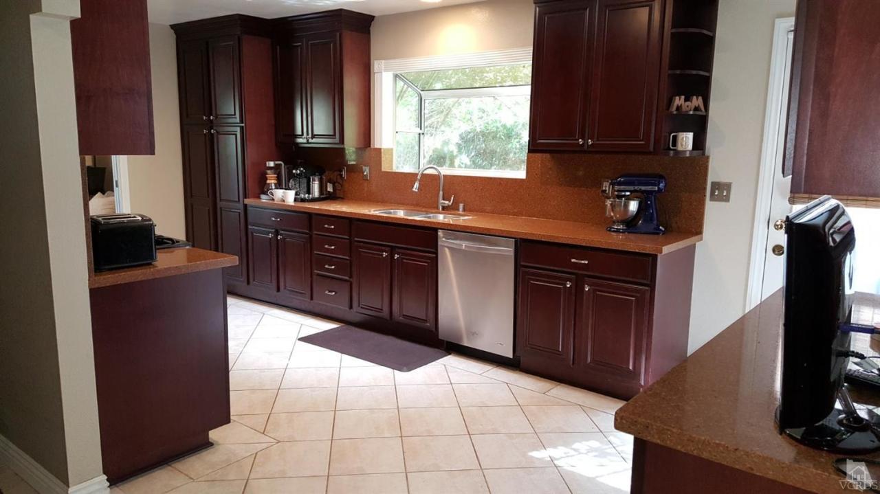 6392 White Street Simi Valley, CA 93063 - Photo 9 of 30 a kitchen with a sink and a refrigerator
