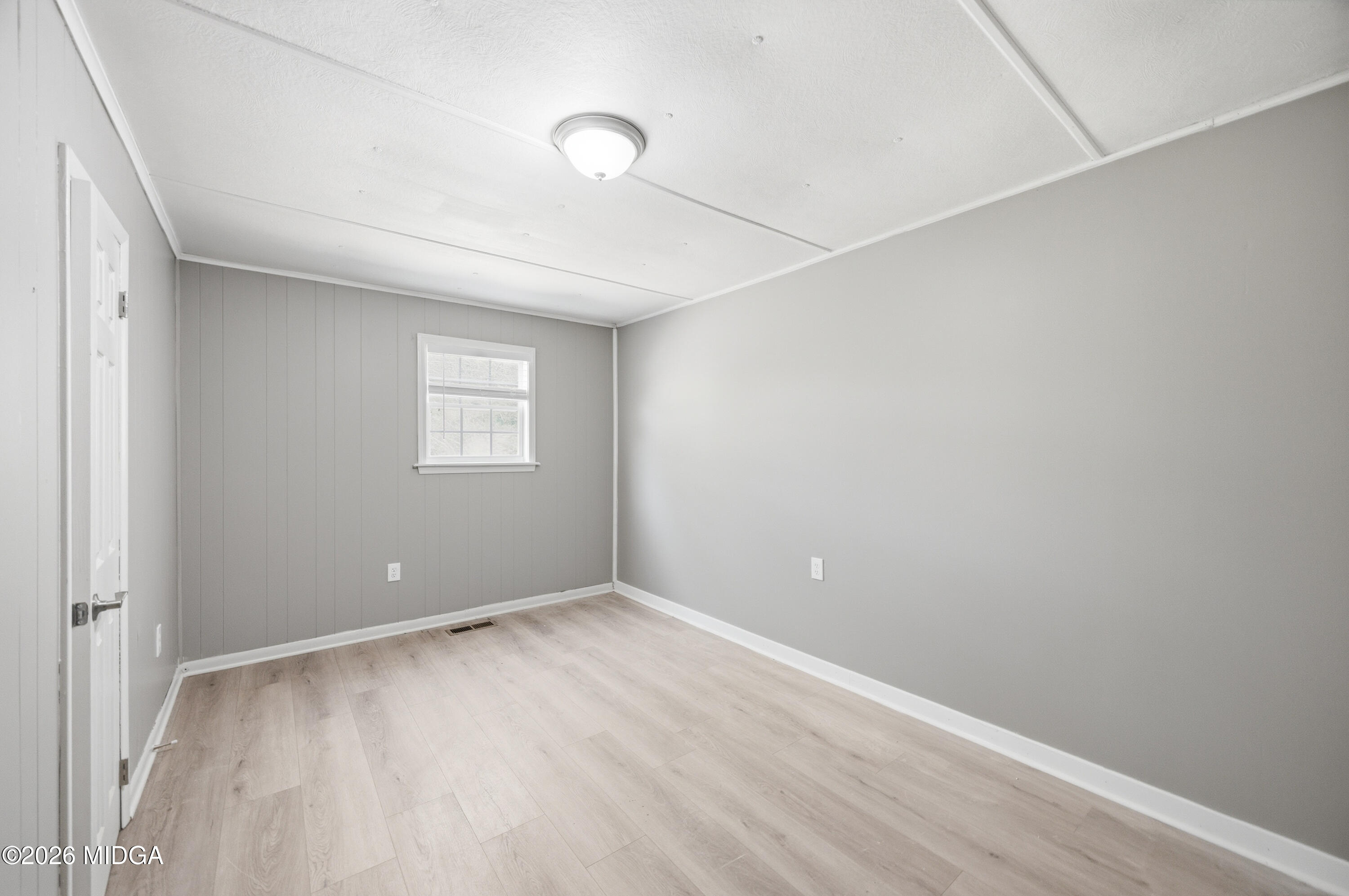 427 Gun Club Road Fort Valley, GA 31030 - Photo 14 of 26 a view of an empty room with a window