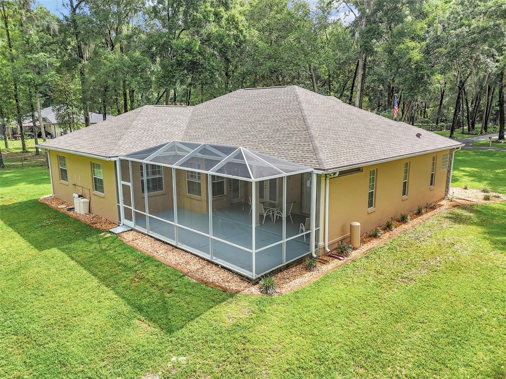 1989 Northwest 111th Loop Ocala, FL 34475 - Photo 41 of 55 a view of a house with backyard and garden