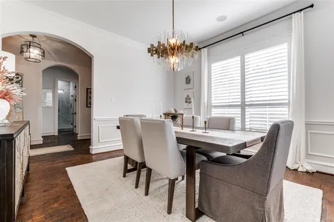 a view of a dining room with furniture and window