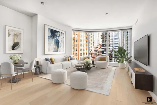 a living room with furniture large window and flat screen tv