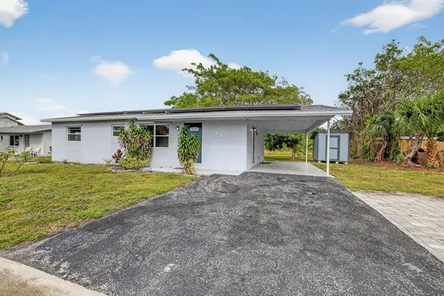 a house view with a garden space
