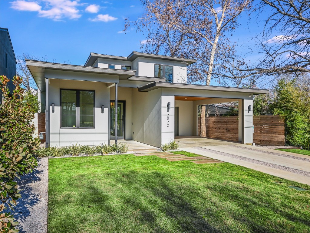 front view of a house with a yard