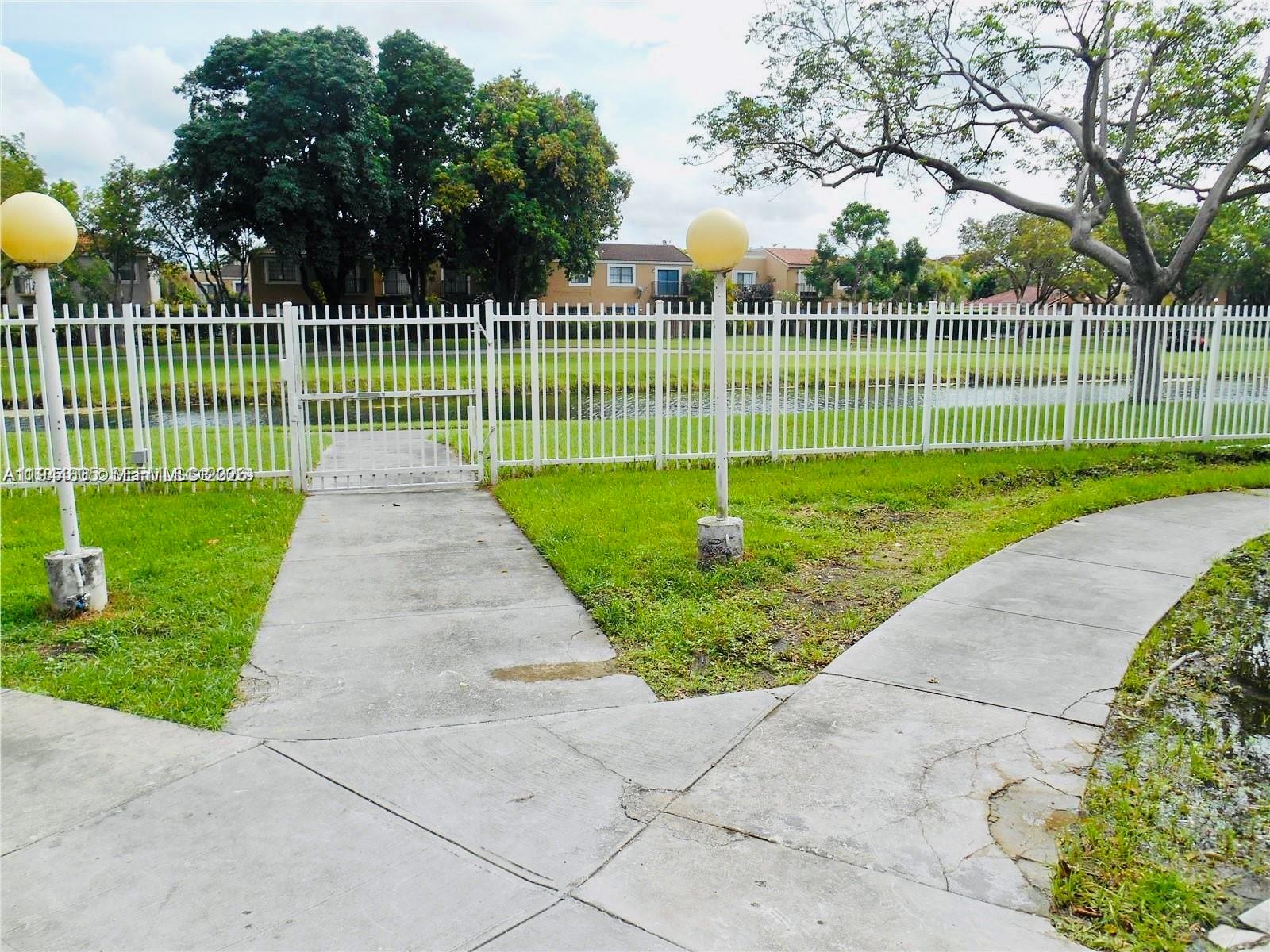 10440 Southwest 156th Court, Unit 722 Miami, FL 33196 - Photo 18 of 23 a view of a park with a large trees