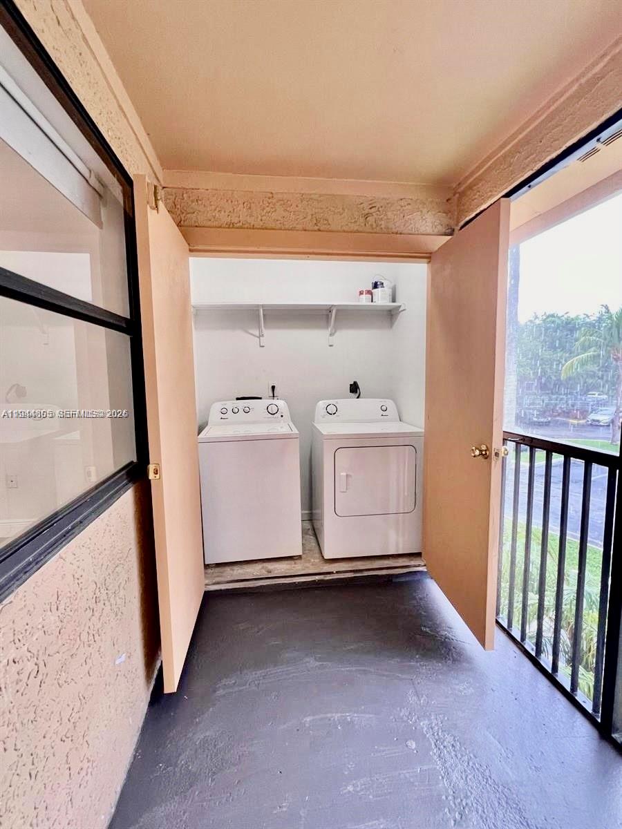 10440 Southwest 156th Court, Unit 722 Miami, FL 33196 - Photo 5 of 23 a utility room with dryer and washer