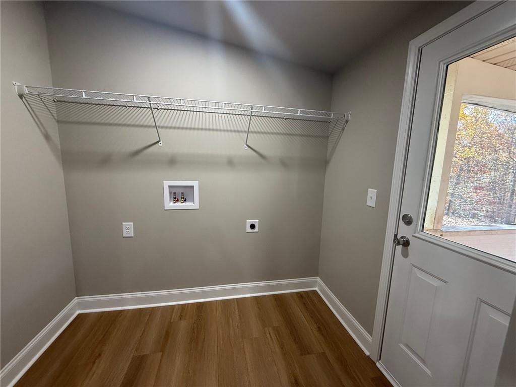 3726 Bolding Road Flowery Branch, GA 30542 - Photo 8 of 8 a view of a room with wooden floor and windows