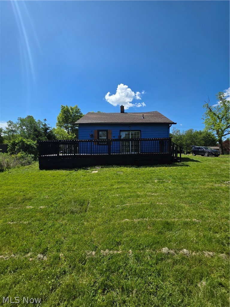 5860 Kirk Road Canfield, OH 44406 - Photo 3 of 12 Blue exterior with a dark-stained wood deck featuring a dark railing