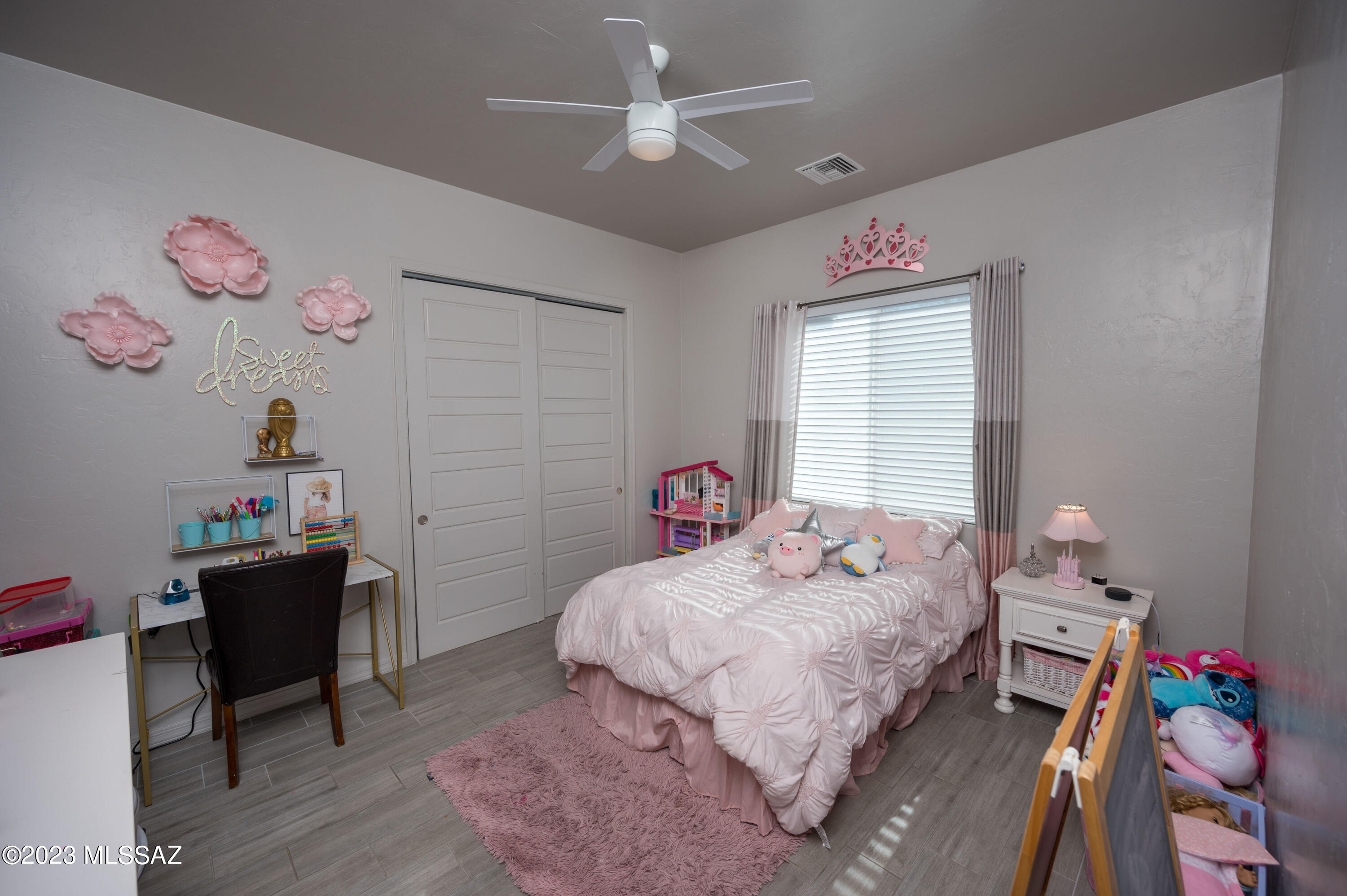 384 Via Estrella Vista Rio Rico, AZ 85648 - Photo 15 of 32 a bedroom with a bed and a desk