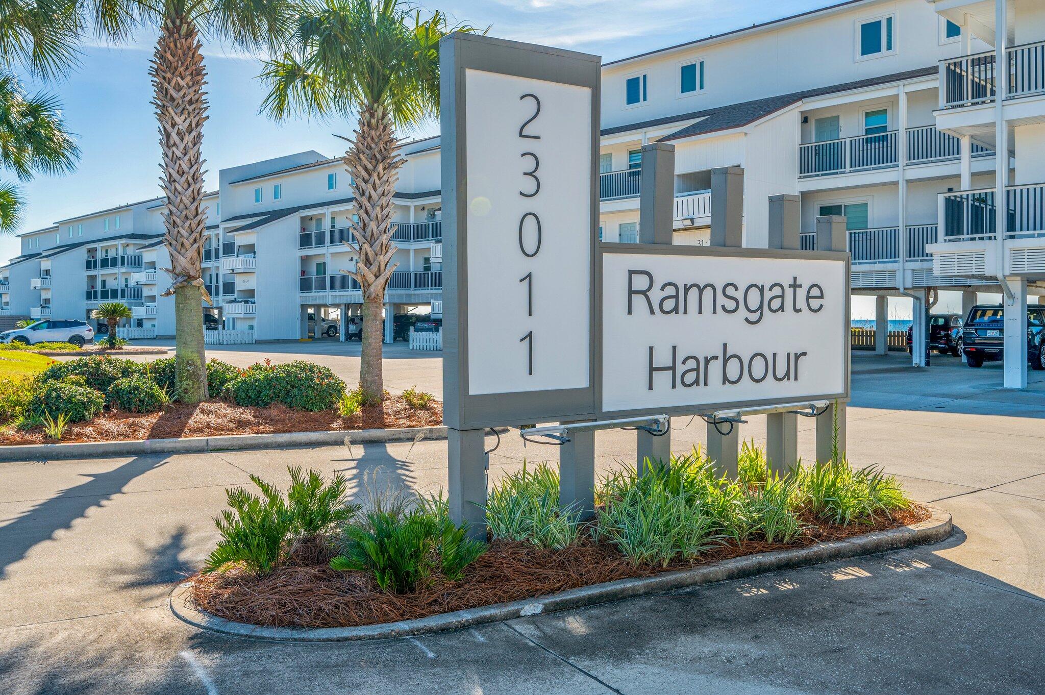 23011 Front Beach Road, Unit E8 Panama City Beach, FL 32413 - Photo 55 of 60 a sign on the side of a building