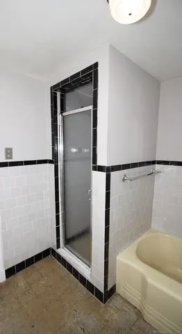 a bathroom with a sink a toilet and bathtub