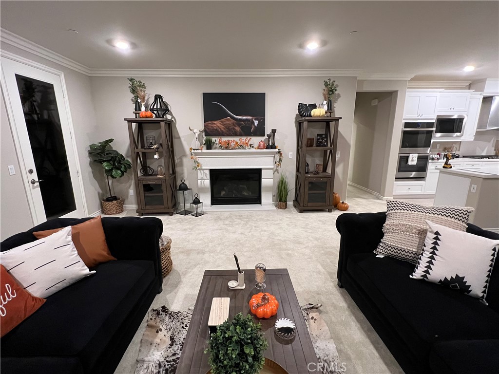 45766 Altree Court Temecula, CA 92592 - Photo 4 of 13 a living room with furniture and a fireplace