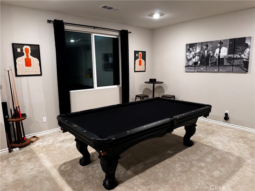 45766 Altree Court Temecula, CA 92592 - Photo 5 of 13 a bed sitting in a room with window and couch