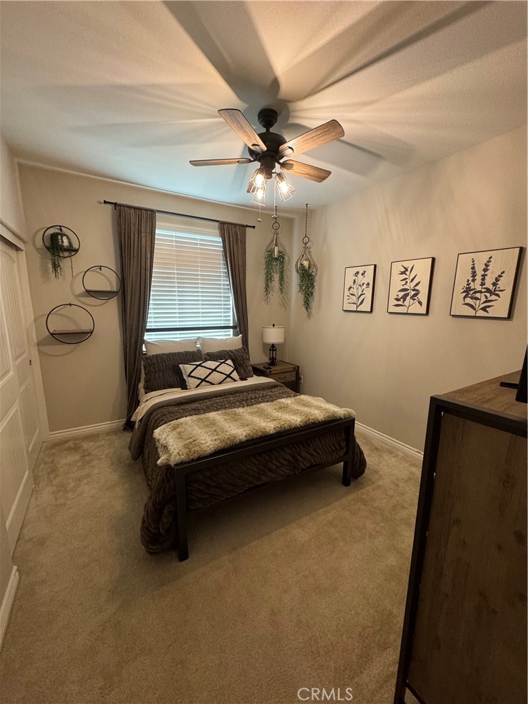 45766 Altree Court Temecula, CA 92592 - Photo 8 of 13 a bedroom with a bed and a window