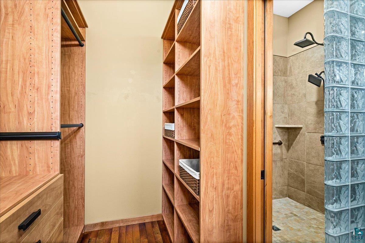 92598 Spells Road Sturgeon Lake, MN 55783 - Photo 33 of 60 Walk in closet featuring dark wood-style floors