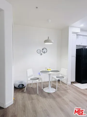 a room with a table and chairs