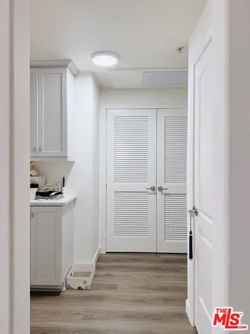 a view of a kitchen with wooden floor