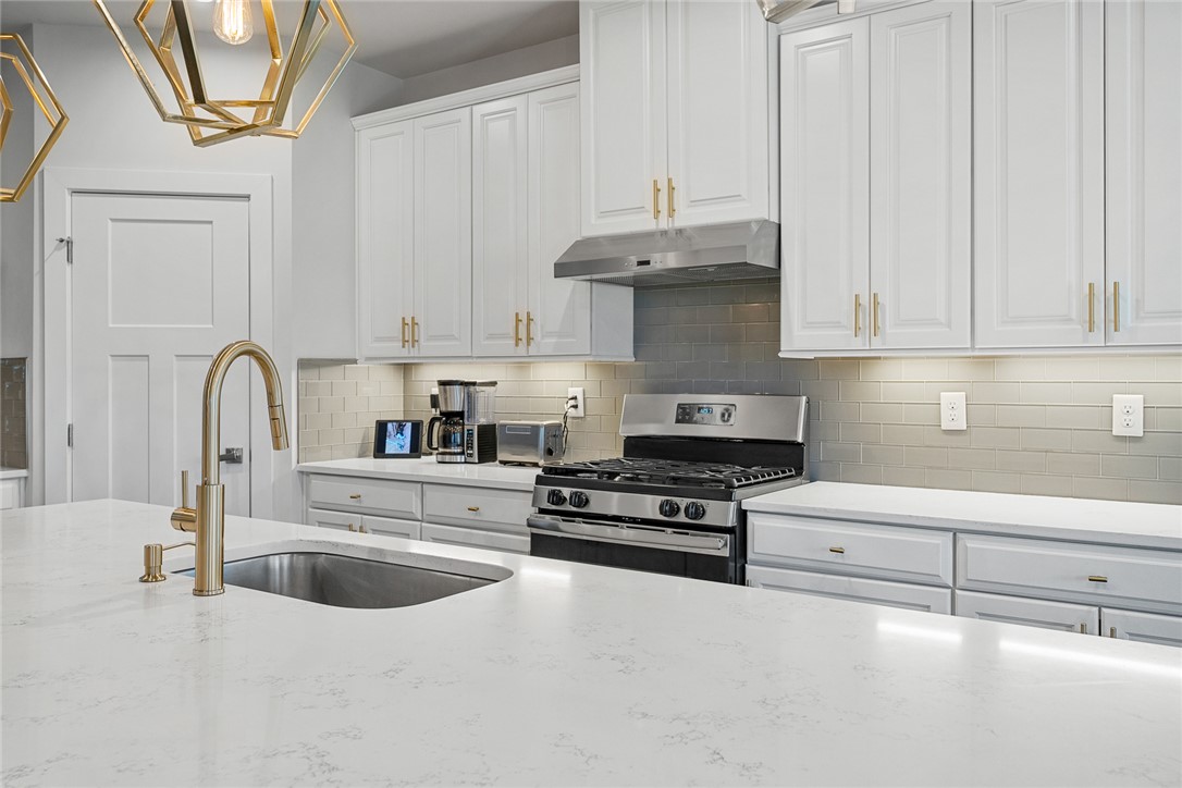 115 Bronson Ridge Anderson, SC 29621 - Photo 16 of 42 This kitchen features a bright ambiance with sleek appliances and ample counter space.