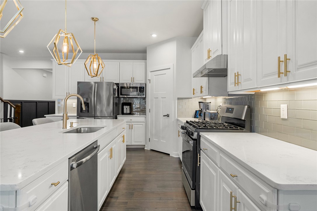 115 Bronson Ridge Anderson, SC 29621 - Photo 17 of 42 This modern kitchen features crisp white cabinetry and sleek stainless steel appliances.