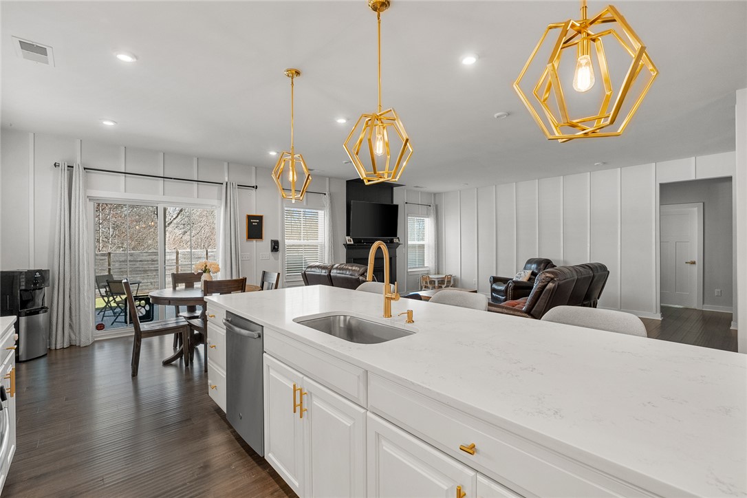 115 Bronson Ridge Anderson, SC 29621 - Photo 18 of 42 This open concept living area boasts a sleek kitchen island, perfect for entertaining and everyday living.