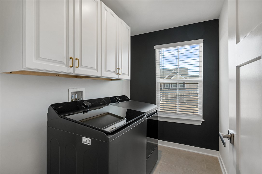 115 Bronson Ridge Anderson, SC 29621 - Photo 22 of 42 This functional laundry room features convenient upper cabinetry and durable tile flooring.
