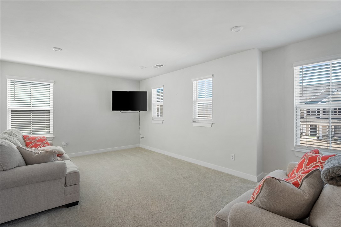 115 Bronson Ridge Anderson, SC 29621 - Photo 24 of 42 This airy living space features ample natural light and a soft, inviting carpet.