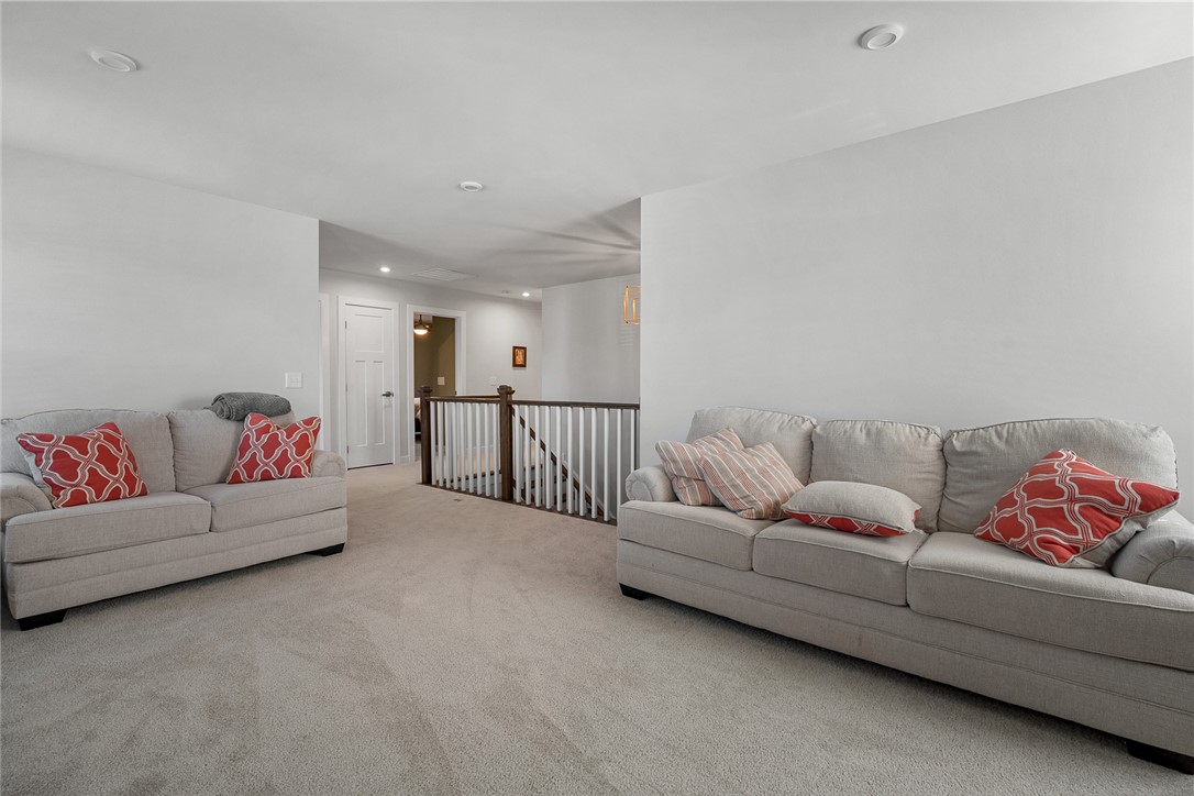 115 Bronson Ridge Anderson, SC 29621 - Photo 25 of 42 This bright and airy space features plush carpeting, recessed lighting, and a charming stairway with elegant railings.