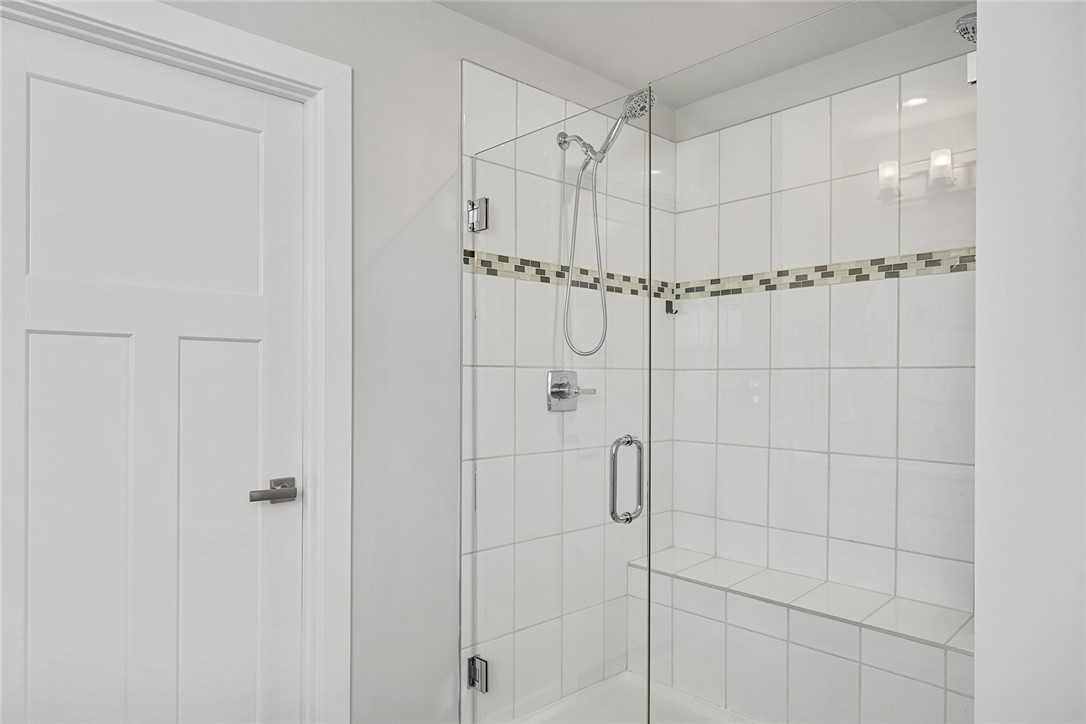115 Bronson Ridge Anderson, SC 29621 - Photo 30 of 42 This sleek shower features modern fixtures and an integrated bench for added convenience.