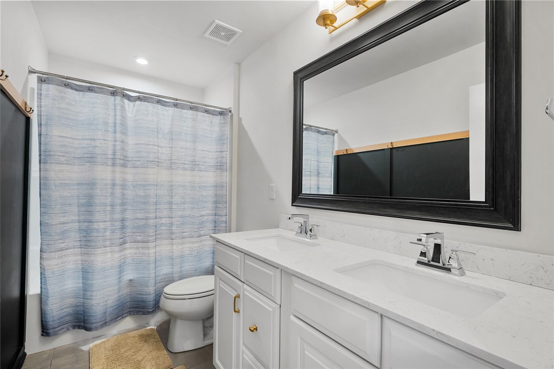 115 Bronson Ridge Anderson, SC 29621 - Photo 35 of 42 This bathroom features a double vanity and a shower-tub combination for ultimate convenience.