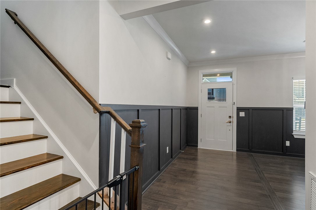 115 Bronson Ridge Anderson, SC 29621 - Photo 4 of 42 This inviting entryway showcases a staircase and rich hardwood flooring, creating a warm welcome.