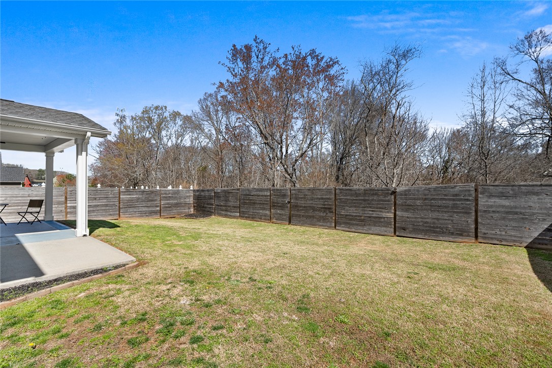115 Bronson Ridge Anderson, SC 29621 - Photo 41 of 42 This spacious yard offers a serene backdrop for outdoor enjoyment and relaxation.