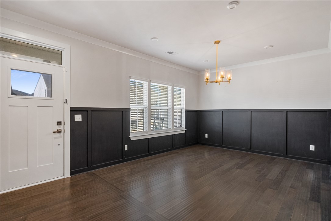 115 Bronson Ridge Anderson, SC 29621 - Photo 5 of 42 This versatile room features warm hardwood floors and wainscoting, perfect for diverse arrangements.