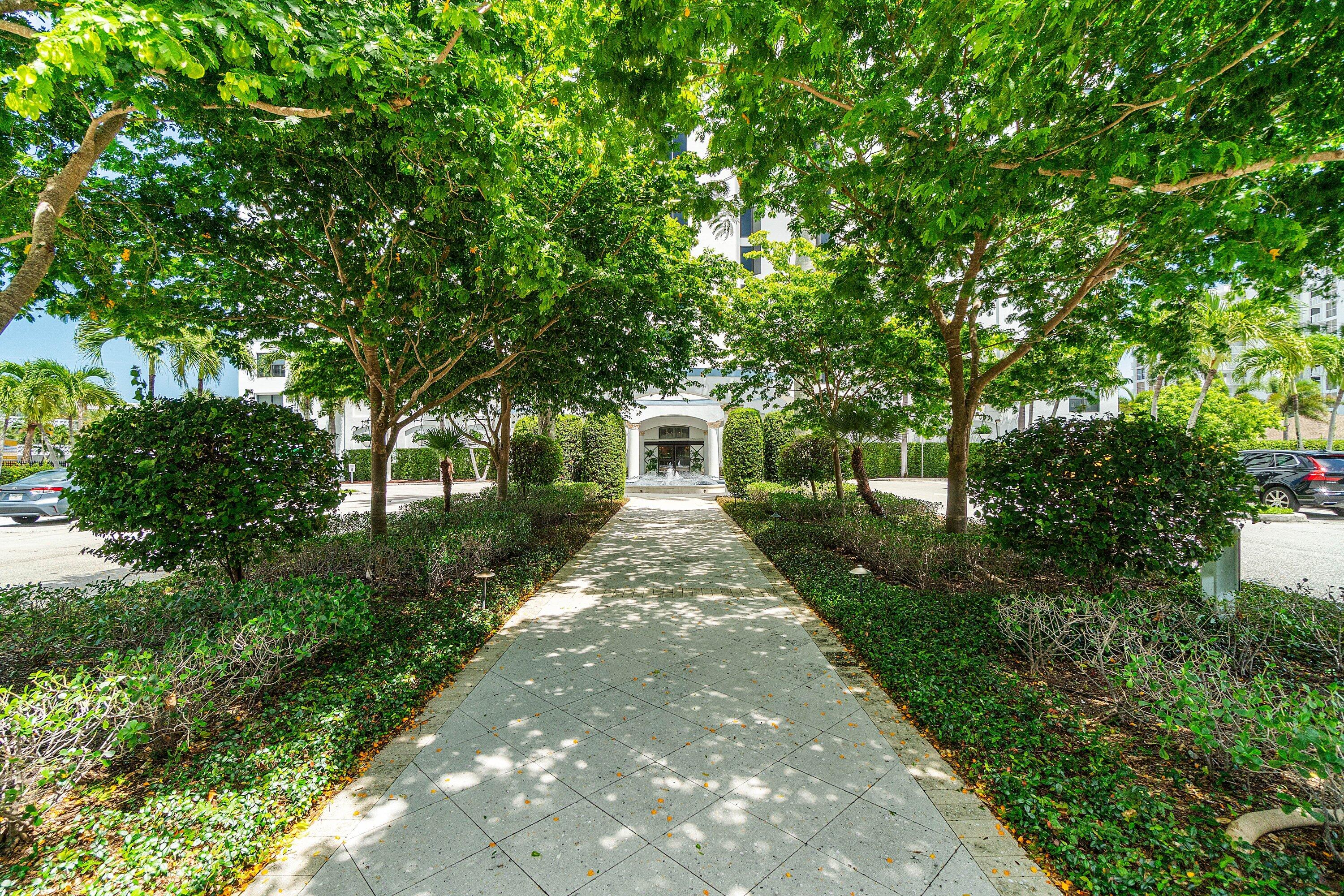 3800 Washington Road, Unit 904 West Palm Beach, FL 33405 - Photo 15 of 27 a front view of a house with garden
