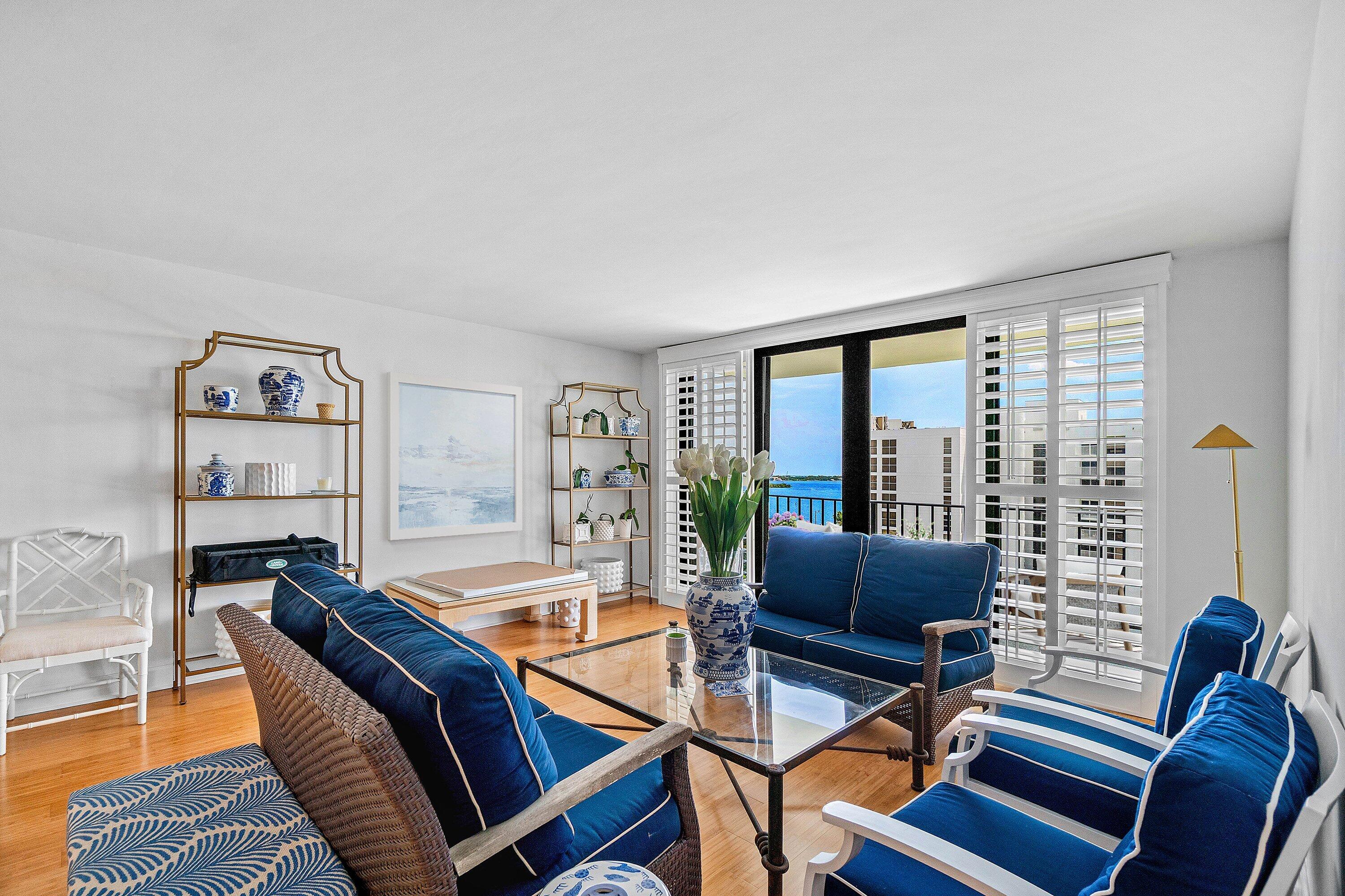 3800 Washington Road, Unit 904 West Palm Beach, FL 33405 - Photo 3 of 27 a living room with furniture and a floor to ceiling window