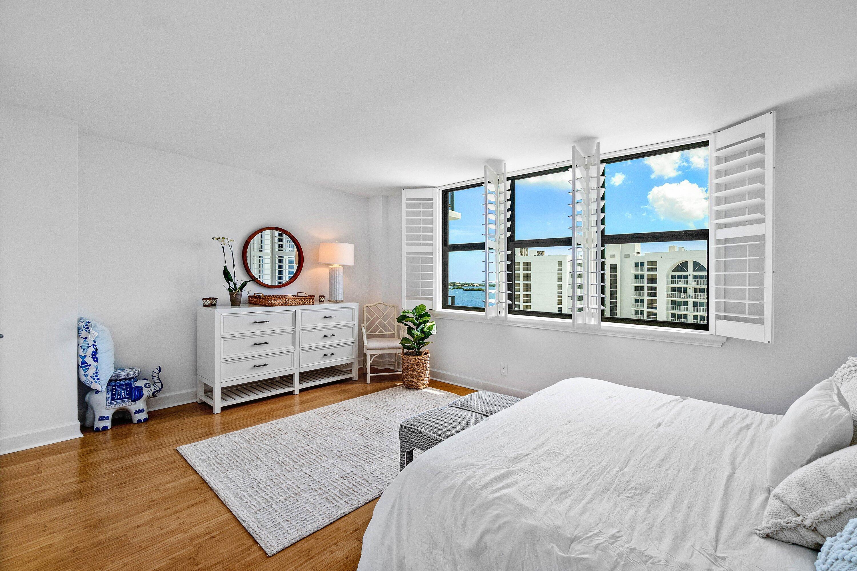3800 Washington Road, Unit 904 West Palm Beach, FL 33405 - Photo 10 of 27 a bedroom with a bed window and dresser