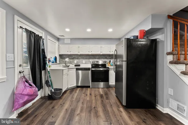 a bedroom with a bed and dresser