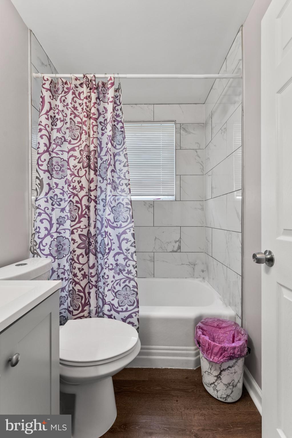 8146 Gray Haven Road Dundalk, MD 21222 - Photo 13 of 18 a bathroom with a sink toilet and bathtub