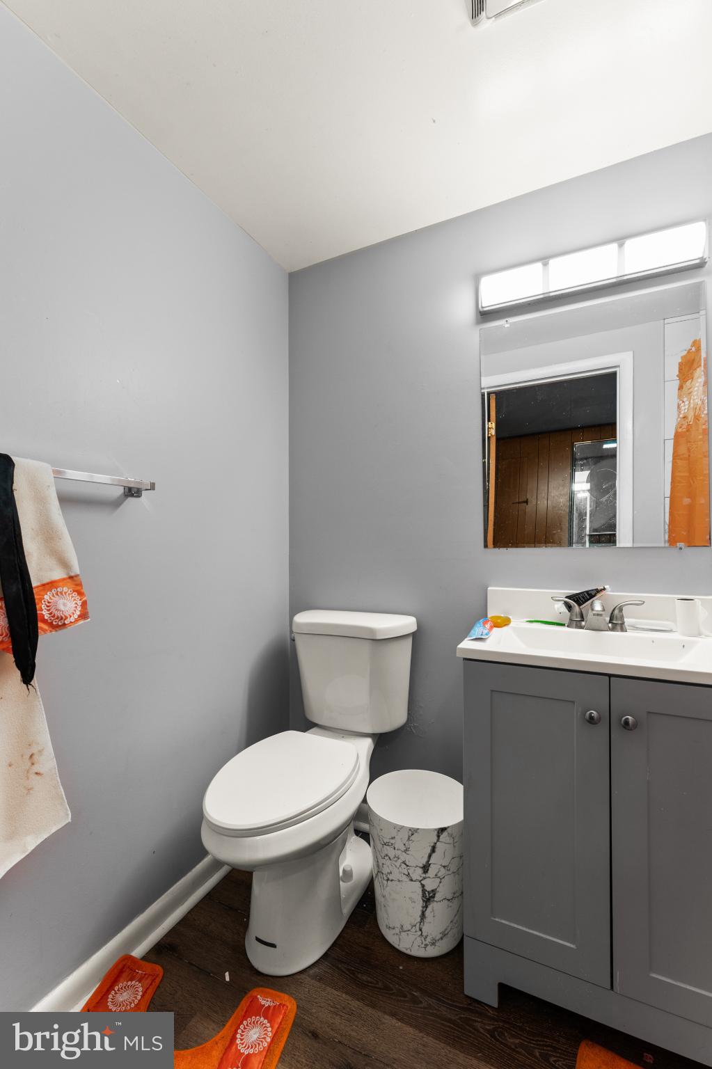 8146 Gray Haven Road Dundalk, MD 21222 - Photo 17 of 18 a bathroom with a toilet sink and mirror