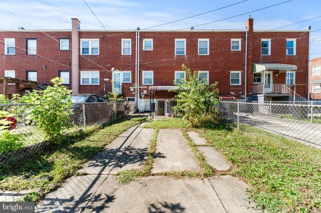 a living room with furniture and stairs