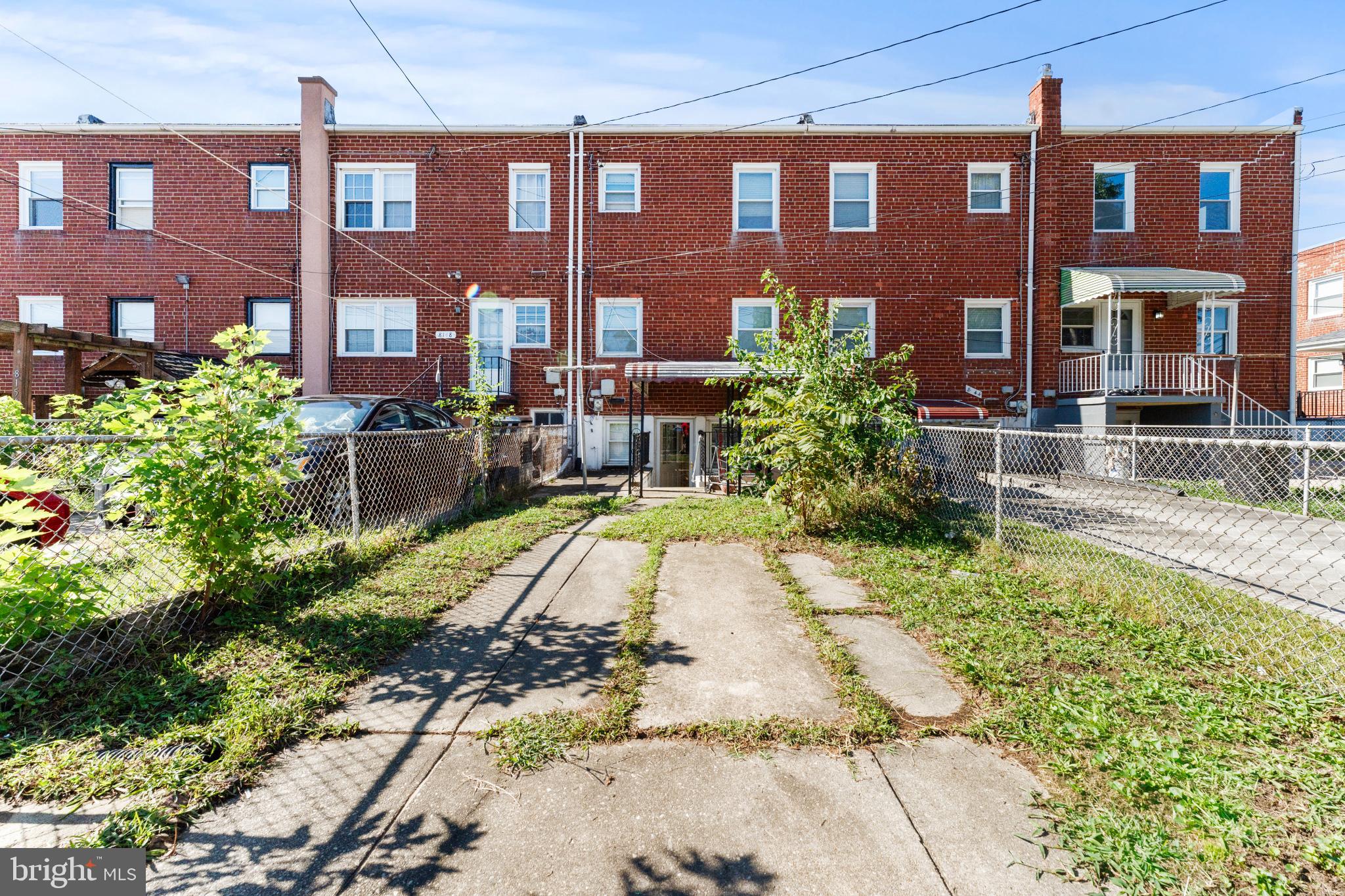 8146 Gray Haven Road Dundalk, MD 21222 - Photo 3 of 18 a view of a building with a yard